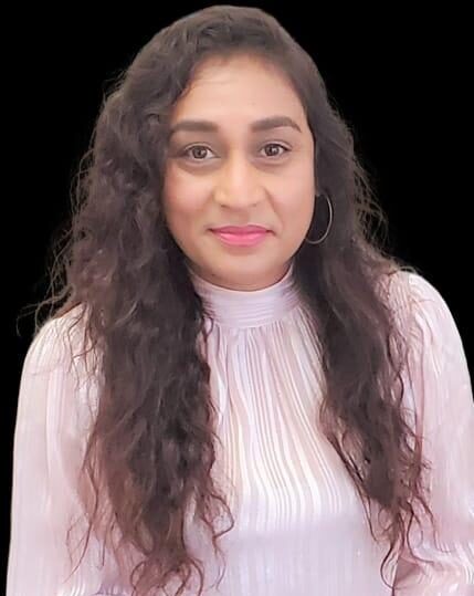 A woman with long hair wearing white shirt.
